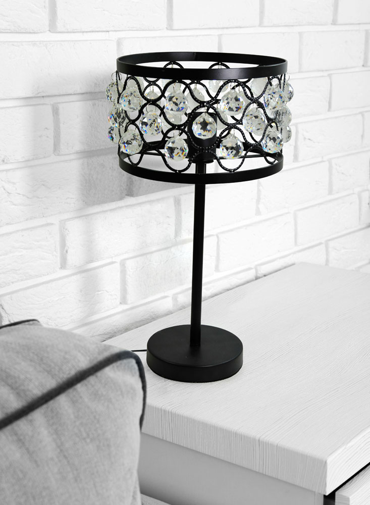 Beautiful modern living room with grey sofa and table lamp